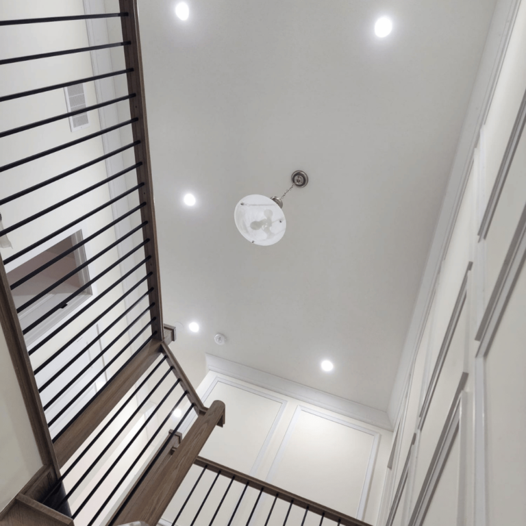 Modern hallway lighting with recessed LED setup, creating a bright and open ambiance.