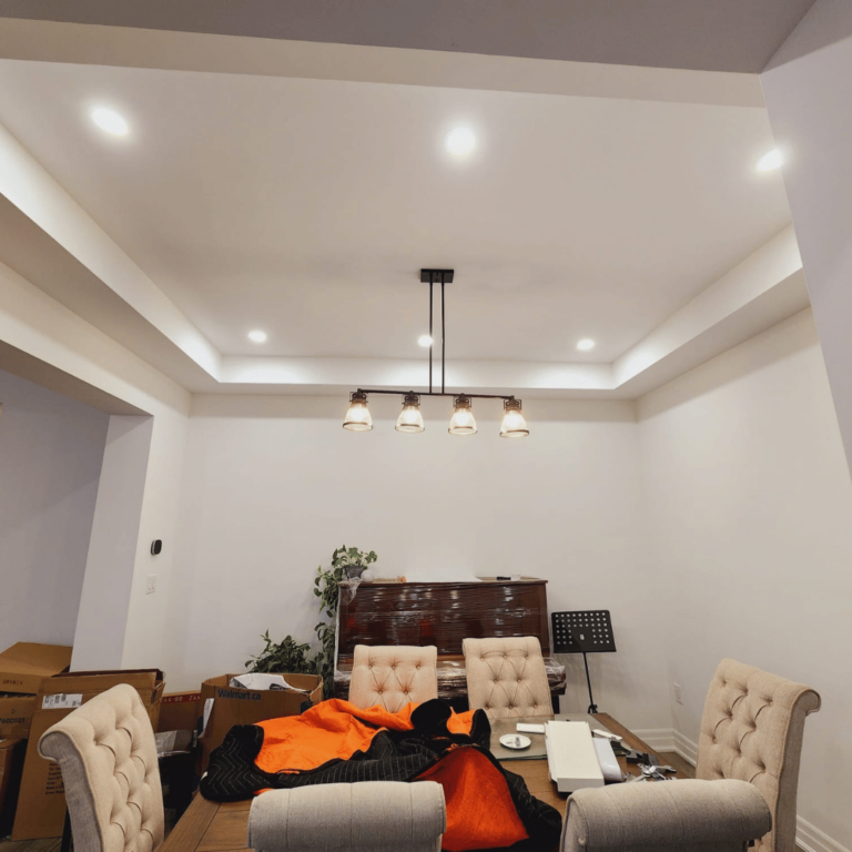 Dining area lighting setup with a perfect blend of recessed and hanging lights.