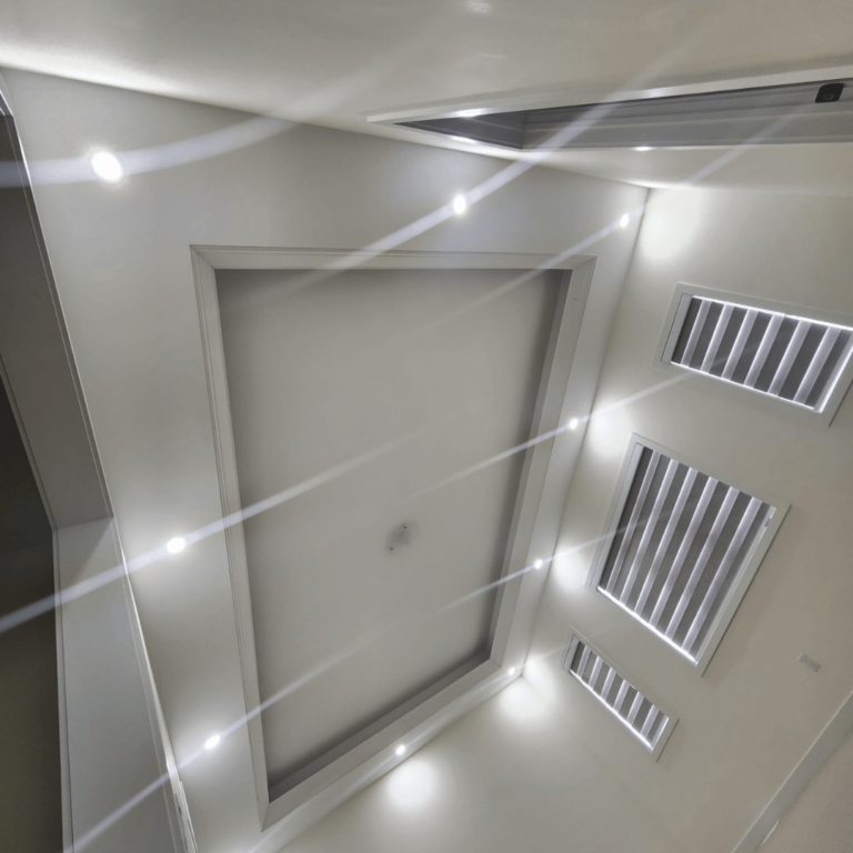 High-end ceiling design with accent lighting, creating a modern and dynamic look.