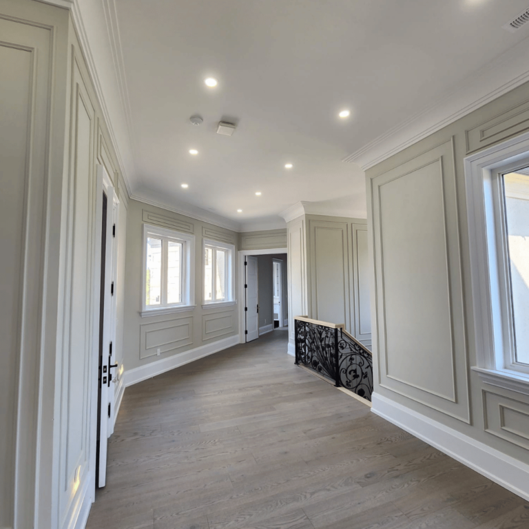 Modern hallway lighting with recessed LED setup, creating a bright and open ambiance.